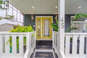 Toronto (O'connor-Parkview) apartment for rent - A yellow door is the centerpiece of this front porch.