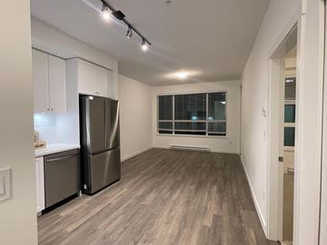 Surrey apartment for rent - A kitchen with a refrigerator and cabinets.