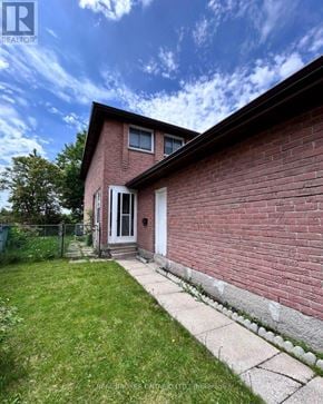 Markham (Milliken Mills West) apartment for rent - A red brick house with a white door and a small porch.