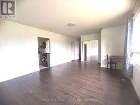 Toronto (L'amoreaux) apartment for rent - A room with a speaker and a chair.