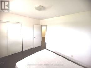 Toronto (L'amoreaux) apartment for rent - A bedroom with a bed, wardrobe and cupboard.