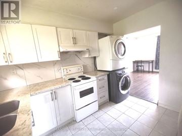 Toronto (L'amoreaux) apartment for rent - A kitchen with white cabinets and a marble countertop.