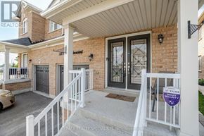 Brampton (Credit Valley) apartment for rent - A house with a sign that says "TELUS SECURITY" on the front porch.