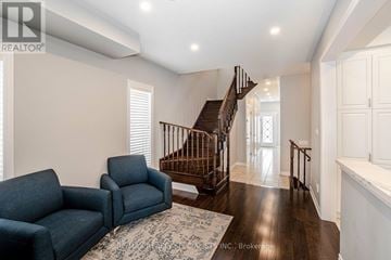 Brampton (Credit Valley) apartment for rent - A living room with a blue couch and a staircase.