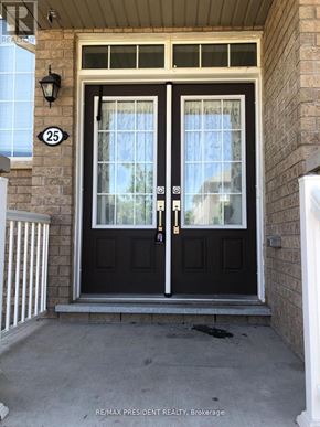 Thorold (Hurricane/Merrittville) apartment for rent - A black double door with a glass window and a number 25 on the wall above it.