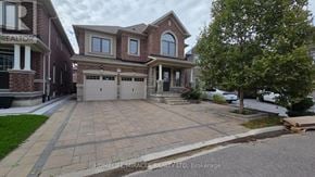 Brampton (Northwest Brampton) apartment for rent - A house with a driveway in front of it.