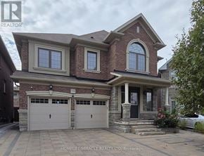 Brampton (Northwest Brampton) apartment for rent - A two-story brick house with a garage and a front porch.