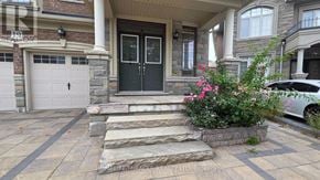 Brampton (Northwest Brampton) apartment for rent - A house with a stone staircase leading to a black door.