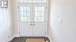 Brampton (Northwest Brampton) apartment for rent - A white door with glass panels is closed.