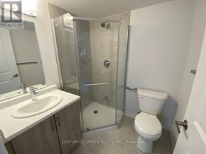Cambridge townhouse for rent - A bathroom with a toilet, sink, and shower.