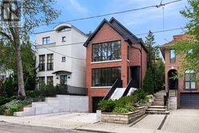 Toronto (Rosedale-Moore Park) apartment for rent - A modern two-story house with a red brick exterior and a white section on the upper floor.