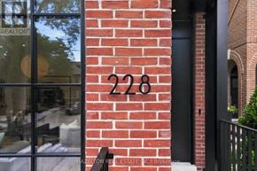 Toronto (Rosedale-Moore Park) apartment for rent - A red brick wall with the number 228 on it.