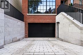 Toronto (Rosedale-Moore Park) apartment for rent - A brick building with a black door and a stone walkway.
