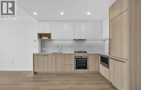 Burnaby apartment for rent - A modern kitchen with wooden cabinets and stainless steel appliances.
