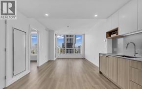 Burnaby apartment for rent - A spacious kitchen with wooden floors and modern appliances.