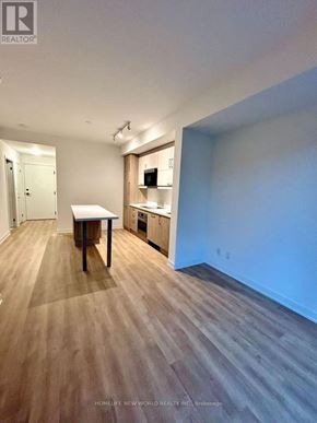Markham (Unionville) condo for rent - A room with a table and a cabinet in it.