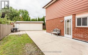 Mississauga (Cooksville) apartment for rent - A red brick house with a white door and a small porch.