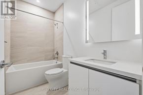 Toronto (Thorncliffe Park) condo for rent - A white bathroom with a toilet, sink and bathtub.