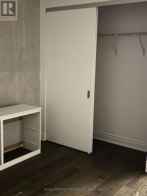 Toronto (Waterfront Communities) condo for rent - A white closet door with a white bench below it.