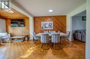 Brampton (Brampton East) apartment for rent - A dining room with a wooden table and chairs.