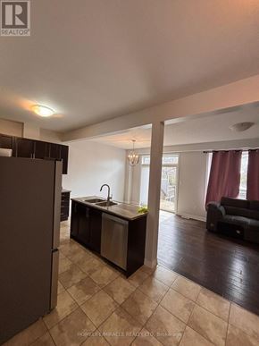Grimsby (Grimsby Beach) townhouse for rent - A kitchen with a sink and a refrigerator.