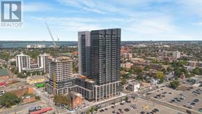 Hamilton (Corktown) condo for rent - A cityscape with a prominent building under construction in the foreground.
