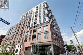 Toronto (Regent Park) condo for rent - A tall building with the words "Dreaming Way" on the front.