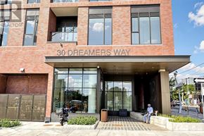 Toronto (Regent Park) condo for rent - A building with the name 30 Dreamers Way on it.