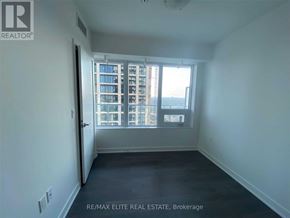 Toronto (Mount Pleasant West) condo for rent - A room with a view of a building outside the window.