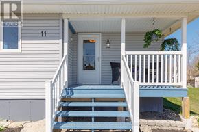 Collingwood apartment for rent - A house number 11 with a porch and a blue staircase.