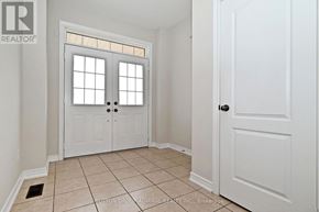 Vaughan (Patterson) townhouse for rent - A white door with a glass window is in a room with white walls.