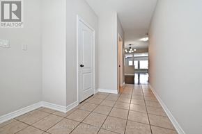 Vaughan (Patterson) townhouse for rent - A hallway with a white door and tiled floor.