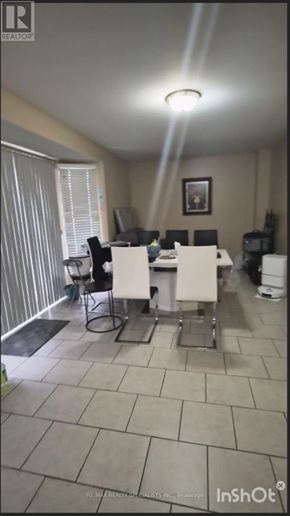 Brampton (Sandringham-Wellington) apartment for rent - A room with a dining table and chairs.