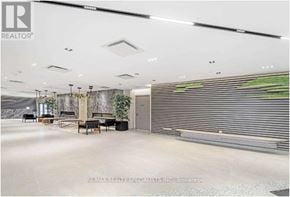 Toronto (Downsview-Roding-Cfb) condo for rent - A spacious lobby with a reception desk and seating area.