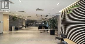 Toronto (Downsview-Roding-Cfb) condo for rent - A modern office lobby with a reception desk and seating area.