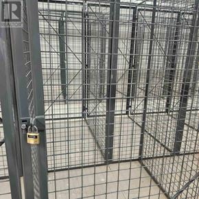 Milton (Tm Timberlea) condo for rent - A metal gate with a lock is closed.