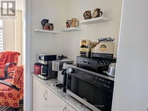 Otonabee-South Monaghan apartment for rent - A kitchen with a coffee maker, toaster, and microwave on the counter.