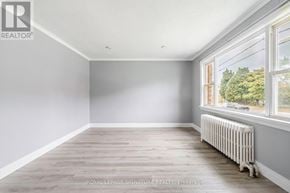 Toronto (O'connor-Parkview) apartment for rent - A room with a window and a radiator on the floor.