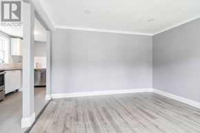 Toronto (O'connor-Parkview) apartment for rent - A spacious room with a kitchen area in the background.