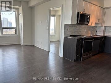 Vaughan (East Woodbridge) condo for rent - A kitchen with a black stove top oven and microwave.