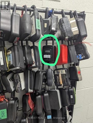 Vaughan (Concord) condo for rent - A bunch of padlocks are hanging on a wall, one of them is circled in green.