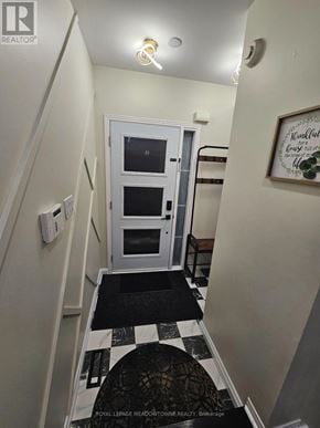 Milton (De Dempsey) apartment for rent - A hallway with a black and white checkered floor.