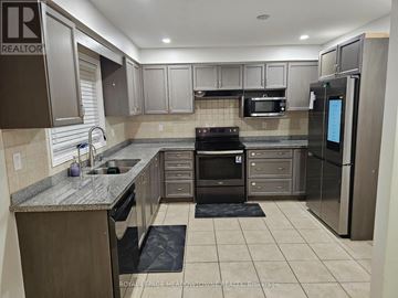 Milton (De Dempsey) apartment for rent - A kitchen with a refrigerator on the right side.