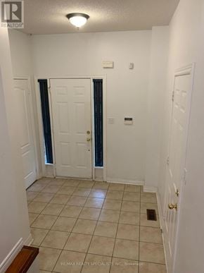 Brampton (Fletcher's Meadow) apartment for rent - A hallway with a white door and a brown floor.