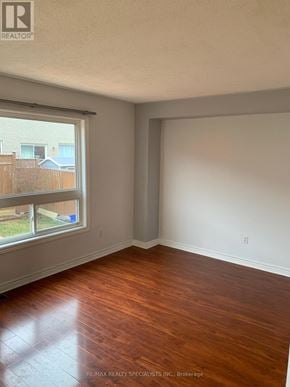 Brampton (Fletcher's Meadow) apartment for rent - A room with a window and wooden flooring.