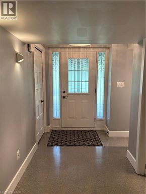 Kitchener apartment for rent - A hallway with a door and a window.