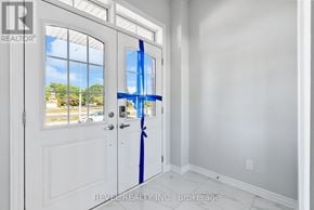 Whitby (Rolling Acres) townhouse for rent - A white door with a blue ribbon tied around it.