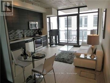 Toronto (Waterfront Communities) house for rent - A modern kitchen with a dining table and chairs.