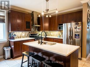 The Nation apartment for rent - A kitchen with dark wood cabinets and a white island.