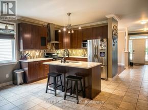 The Nation apartment for rent - A kitchen with a bar stool and a fridge.
